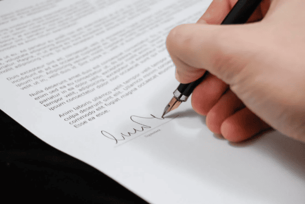 a person signing a document