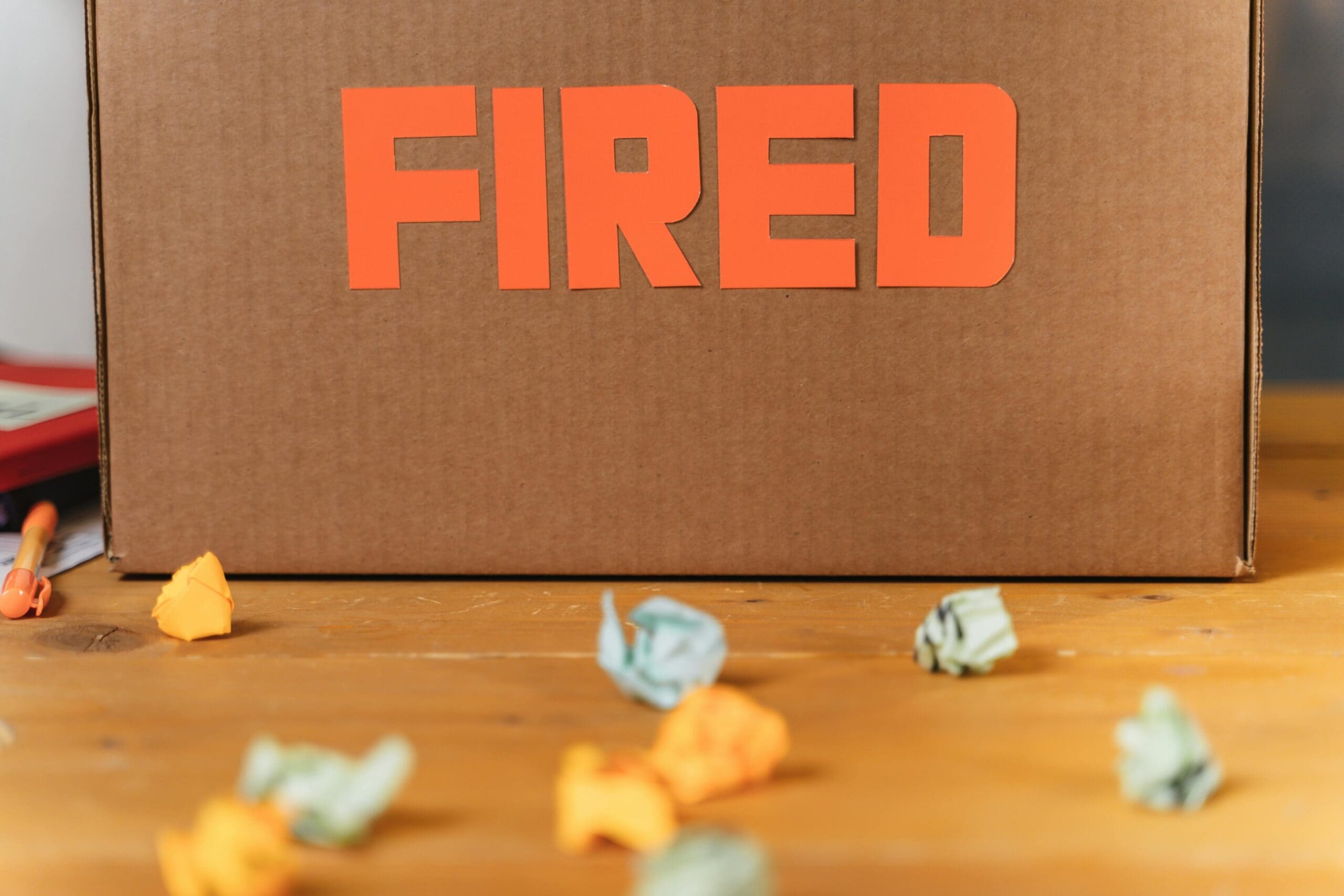 A box with the word, Fired, written on it.